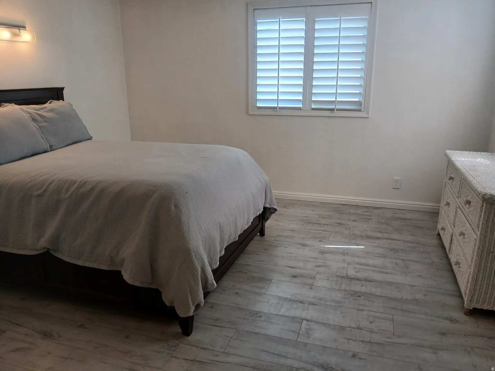 Bedroom featuring light wood-type flooring and baseboards