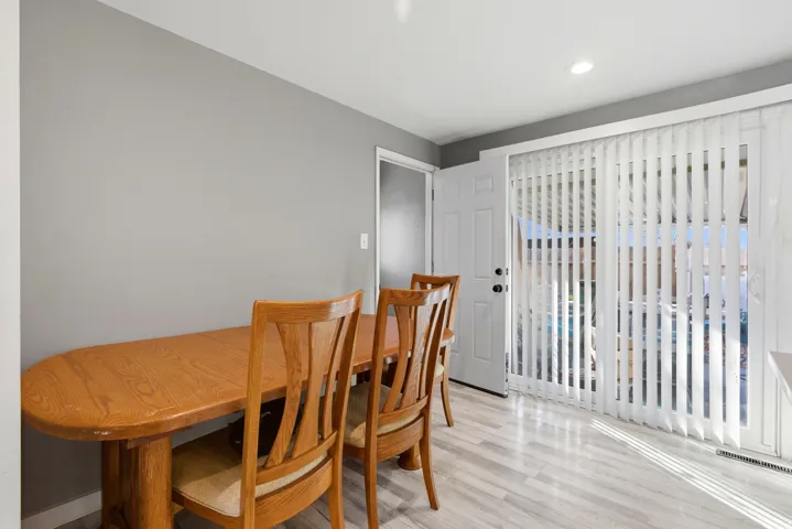 Dining room featuring light wood finished floors and recessed lighting