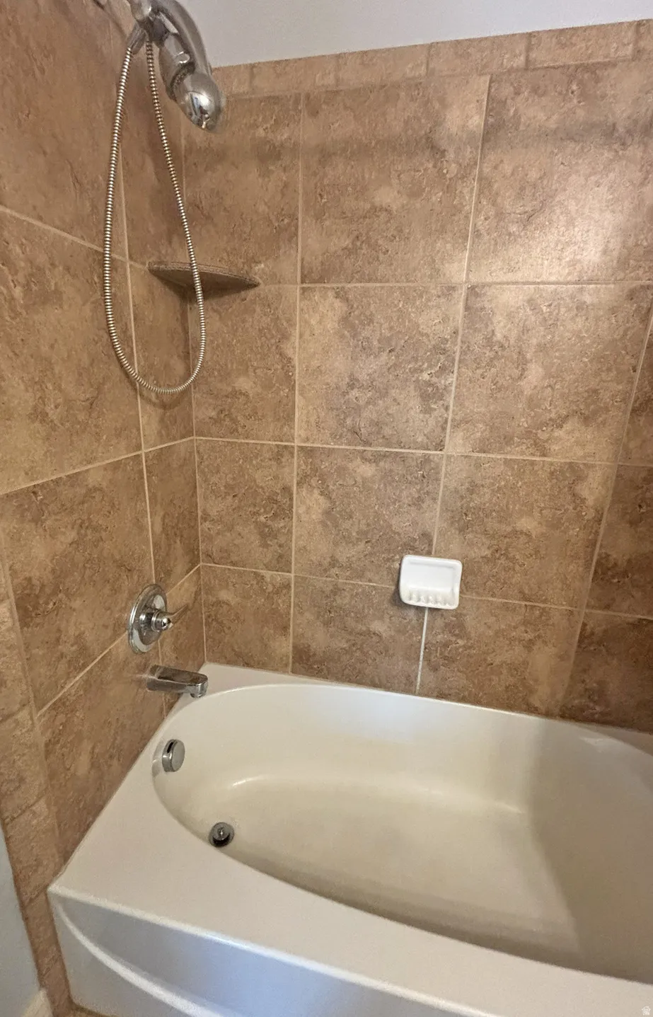 Bathroom with shower / washtub combination