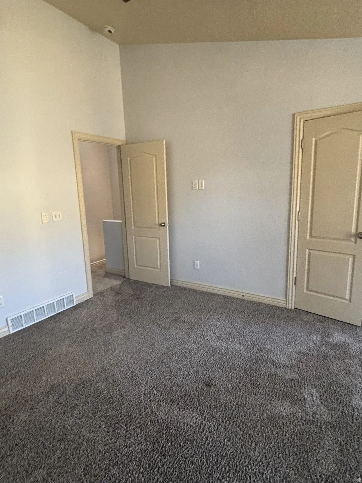 Carpeted spare room featuring baseboards--Master Bedroom