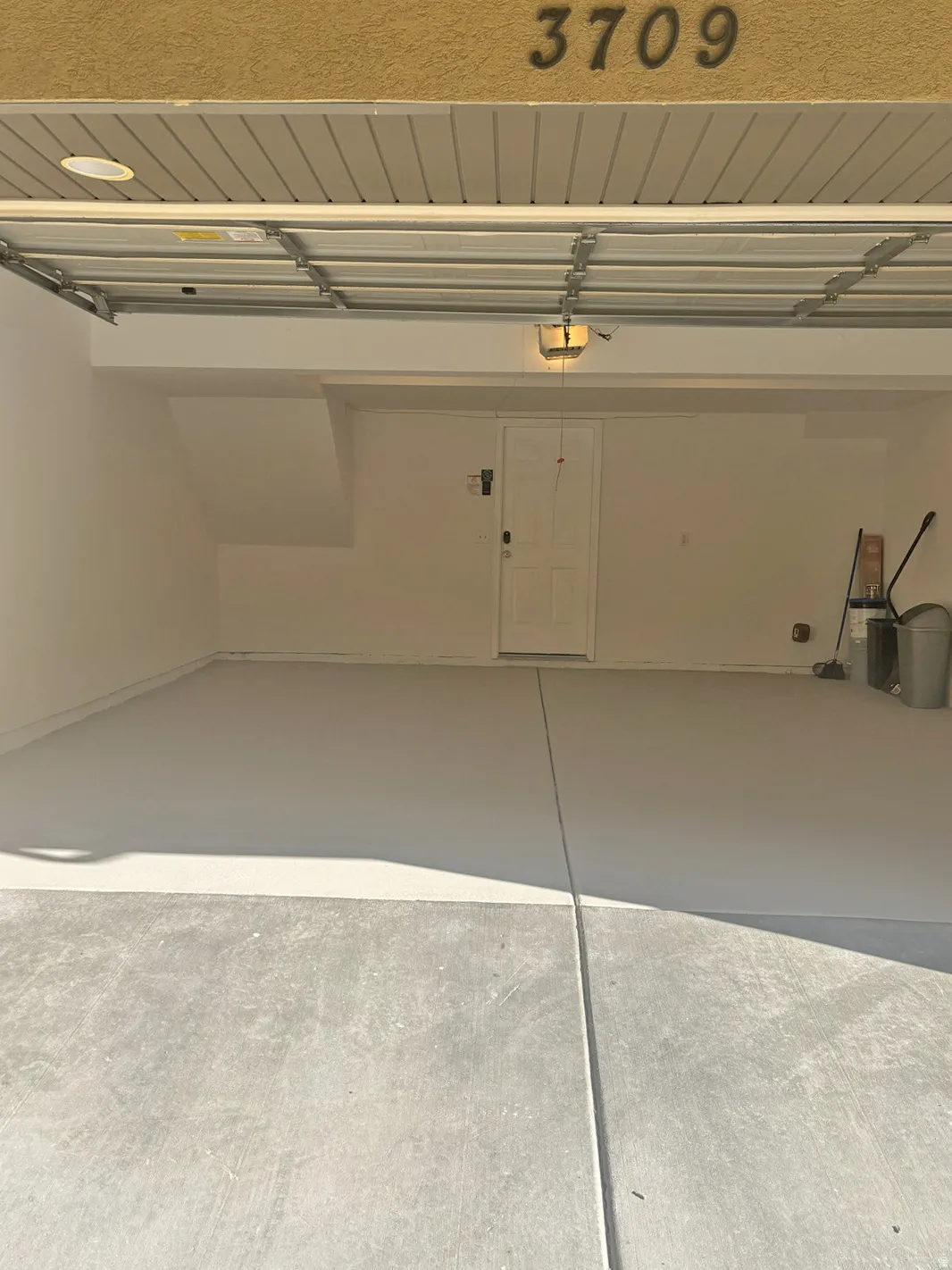 Garage featuring a garage door opener