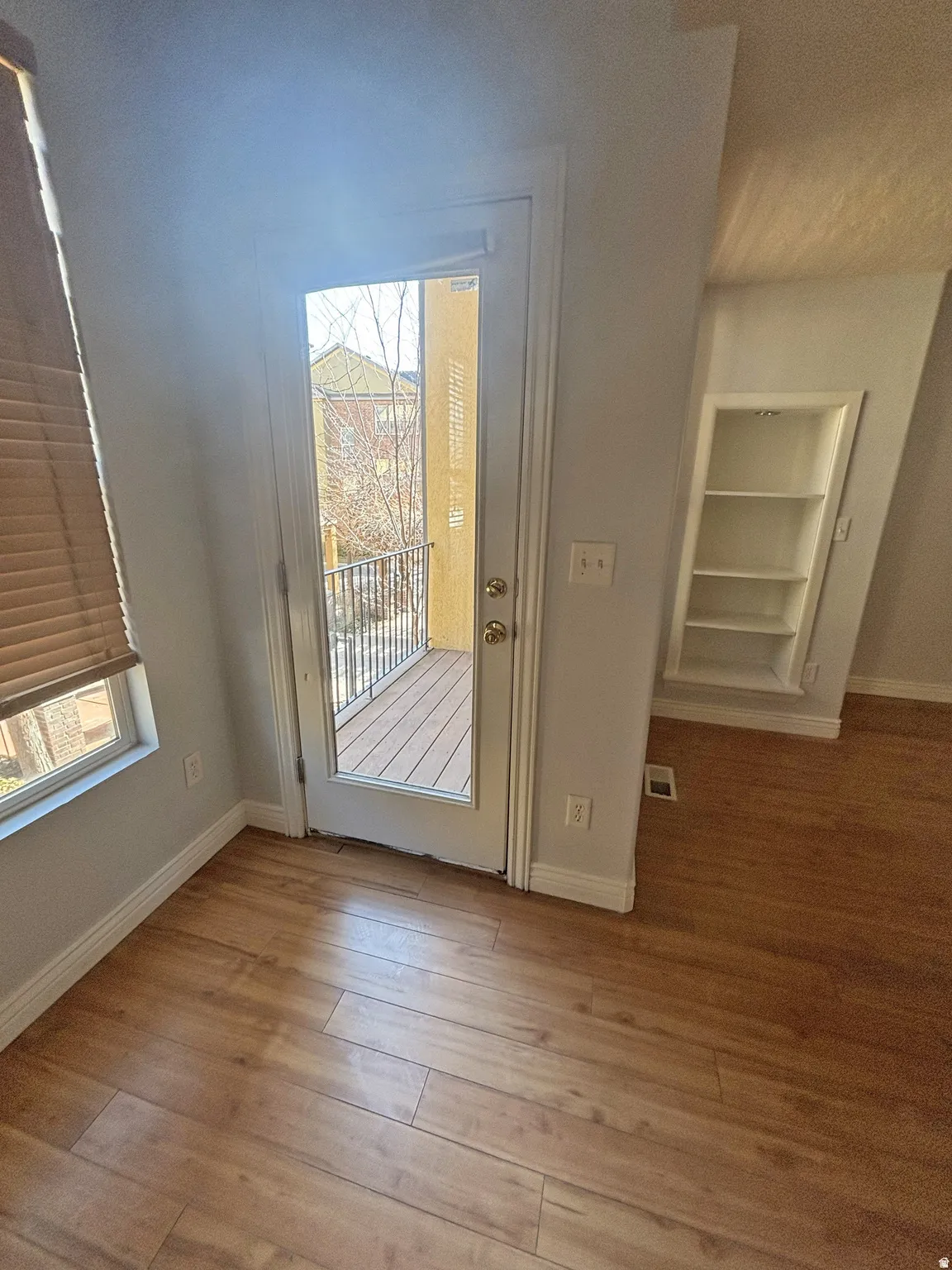 Entryway with wood finished floors