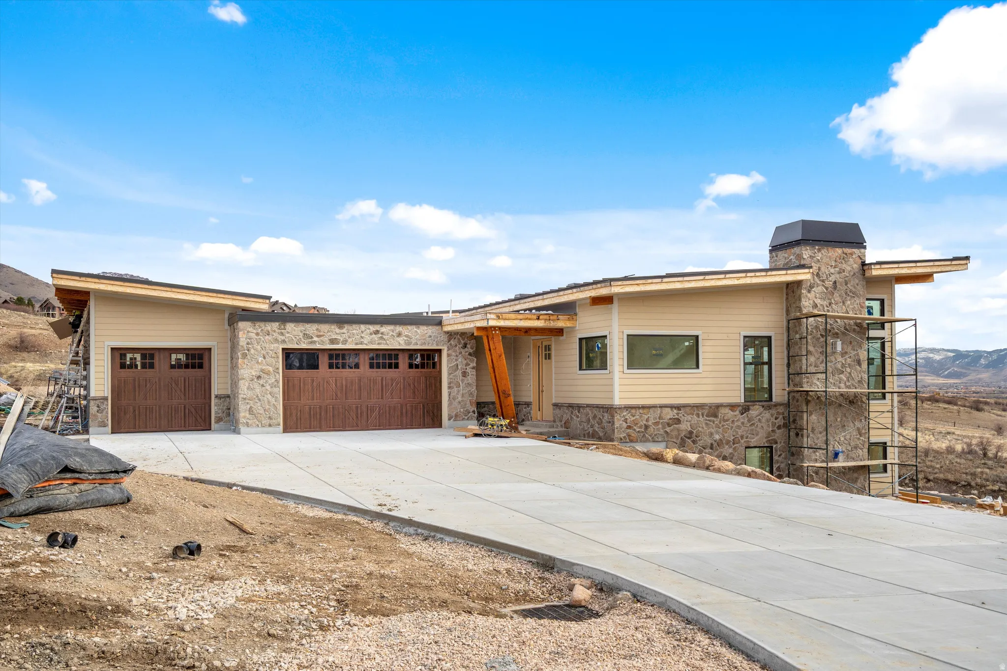 Contemporary exterior featuring stone accents and horizontal siding