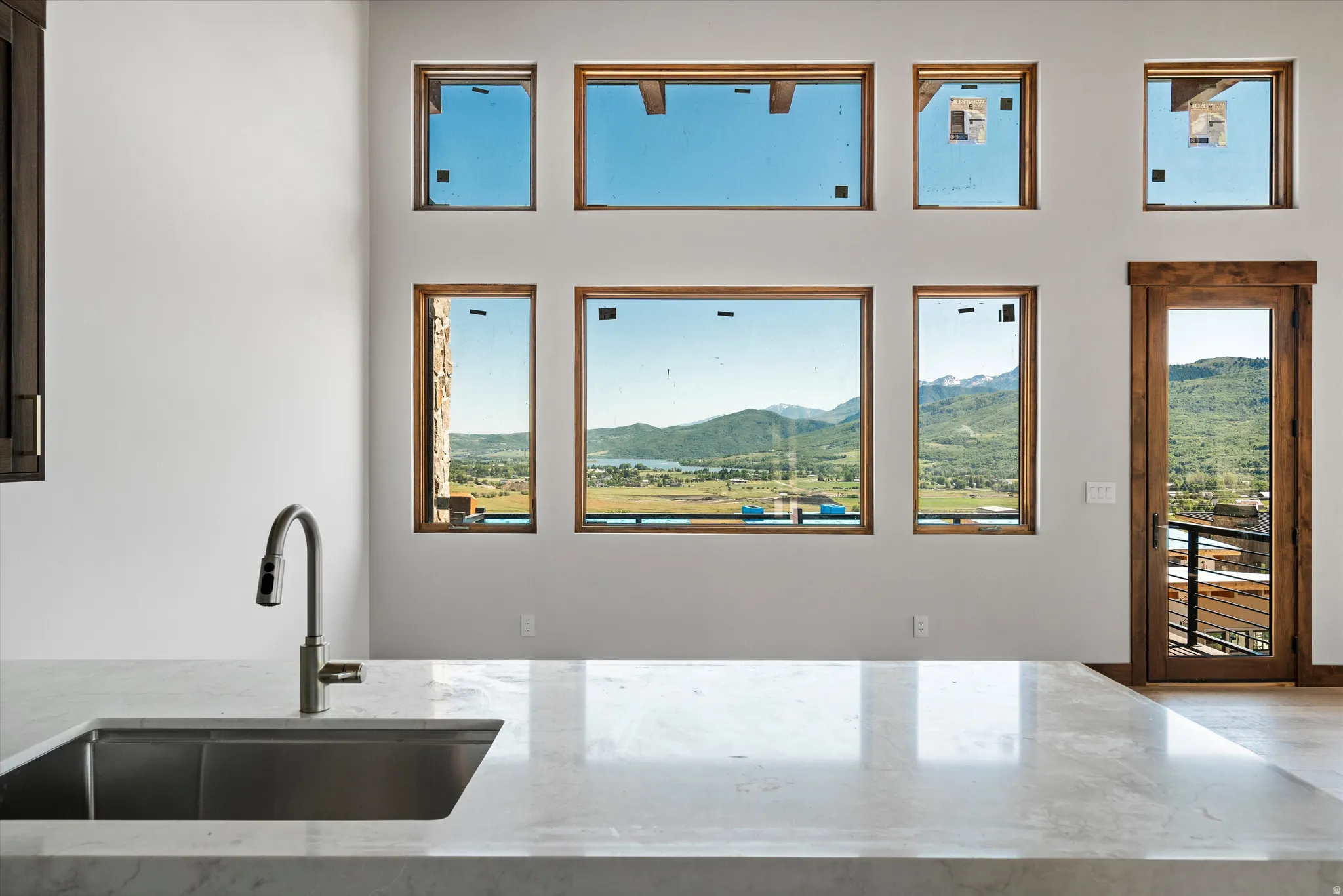 Kitchen island with an undermount sink and a contemporary faucet