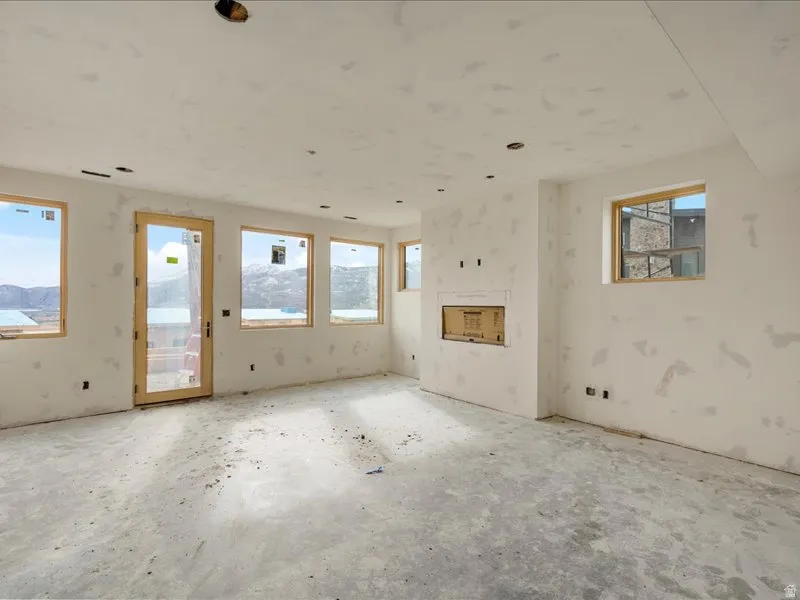 Unfurnished living room with a fireplace