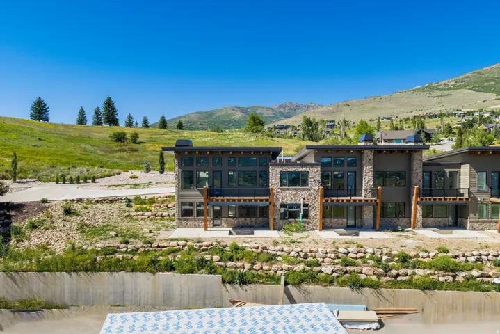Modern multi-story residences featuring stone and siding exteriors