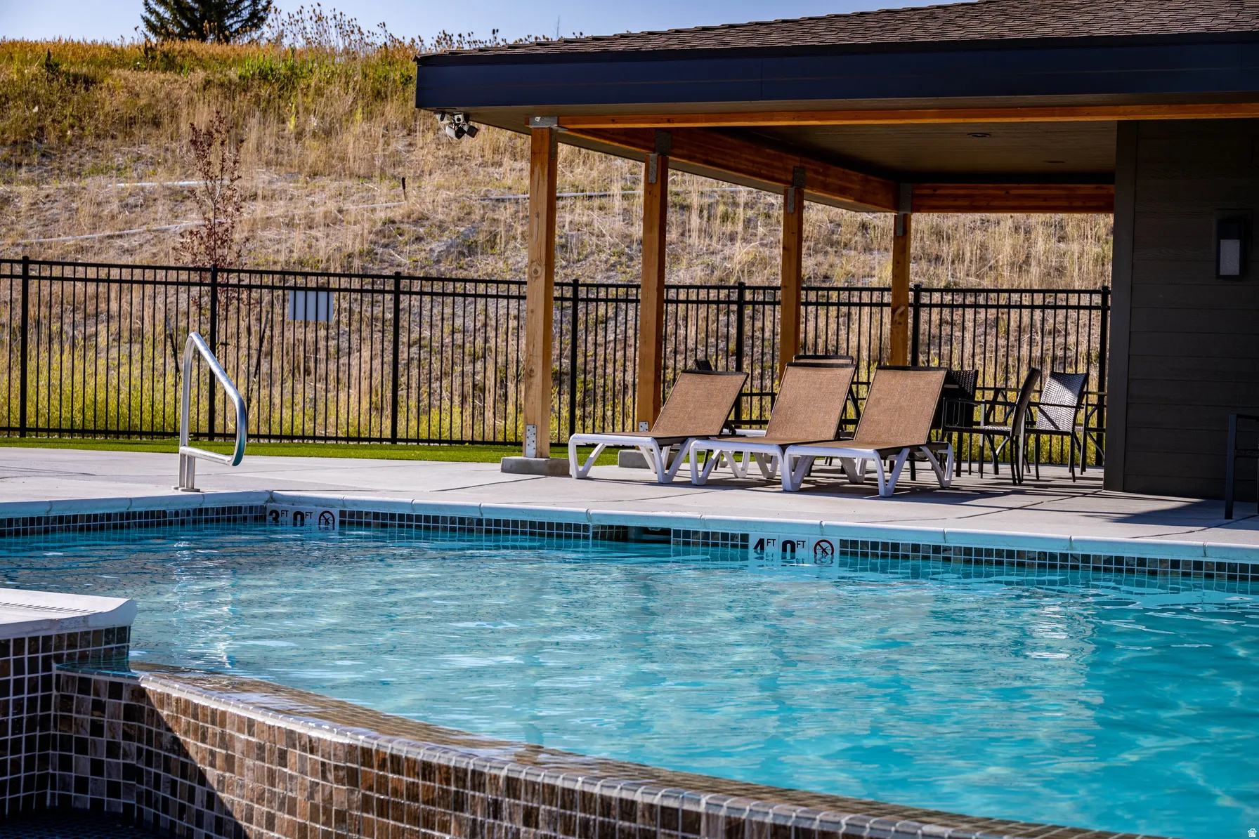 View of swimming pool with a patio area
