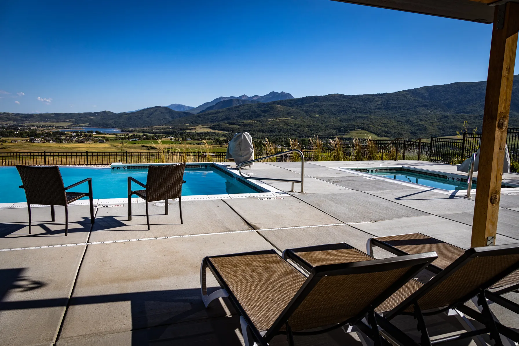 View of swimming pool with a patio area and a mountain view