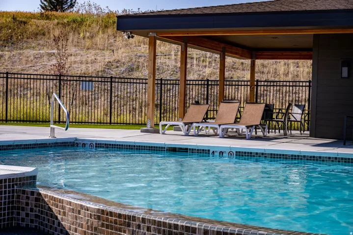 View of swimming pool with a patio area
