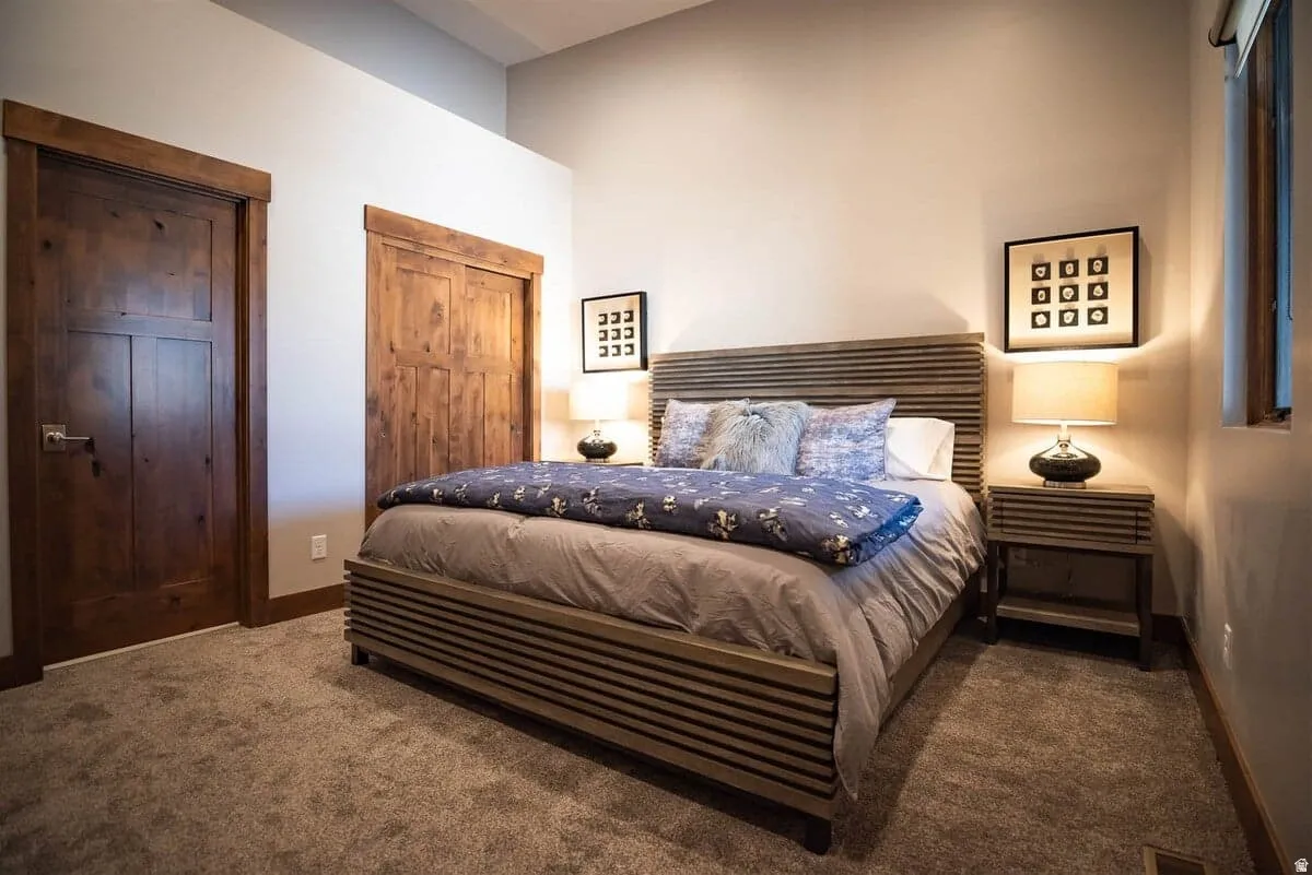 Bedroom with multiple closets and carpet