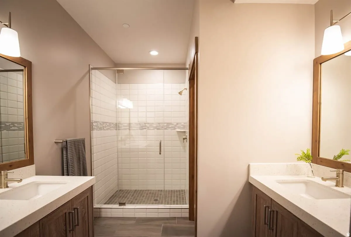 Bathroom with vanity, a shower stall, and recessed lighting