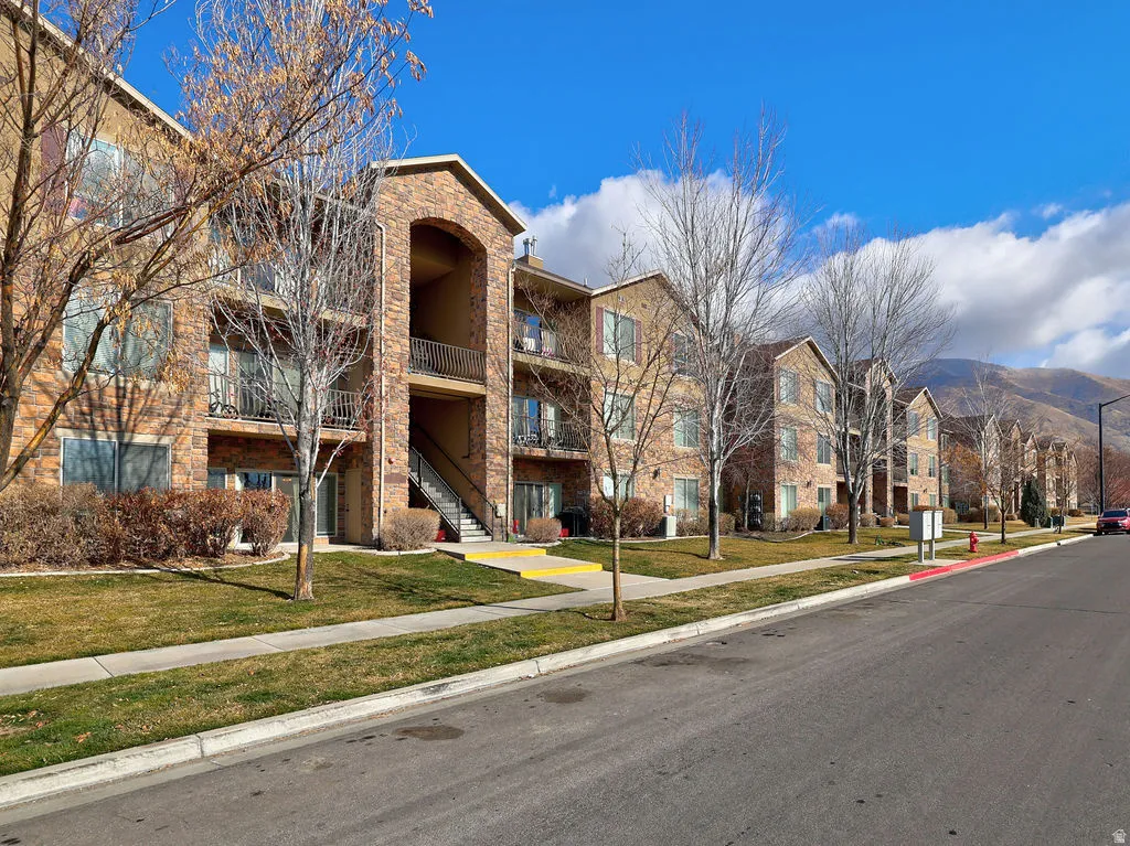View of apartment building / complex featuring a mountain view