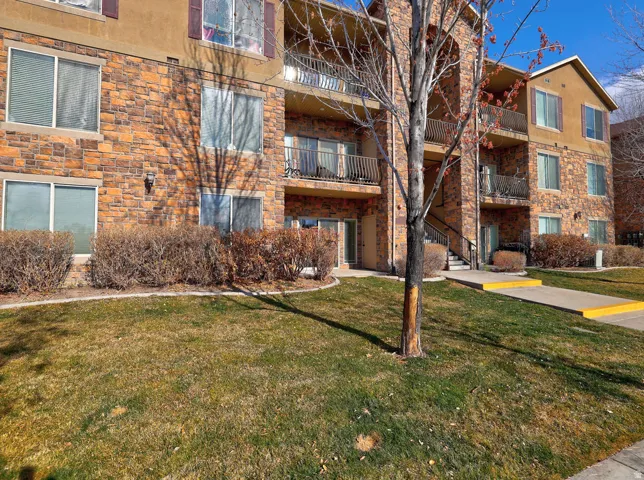 View of apartment building / complex featuring stairway