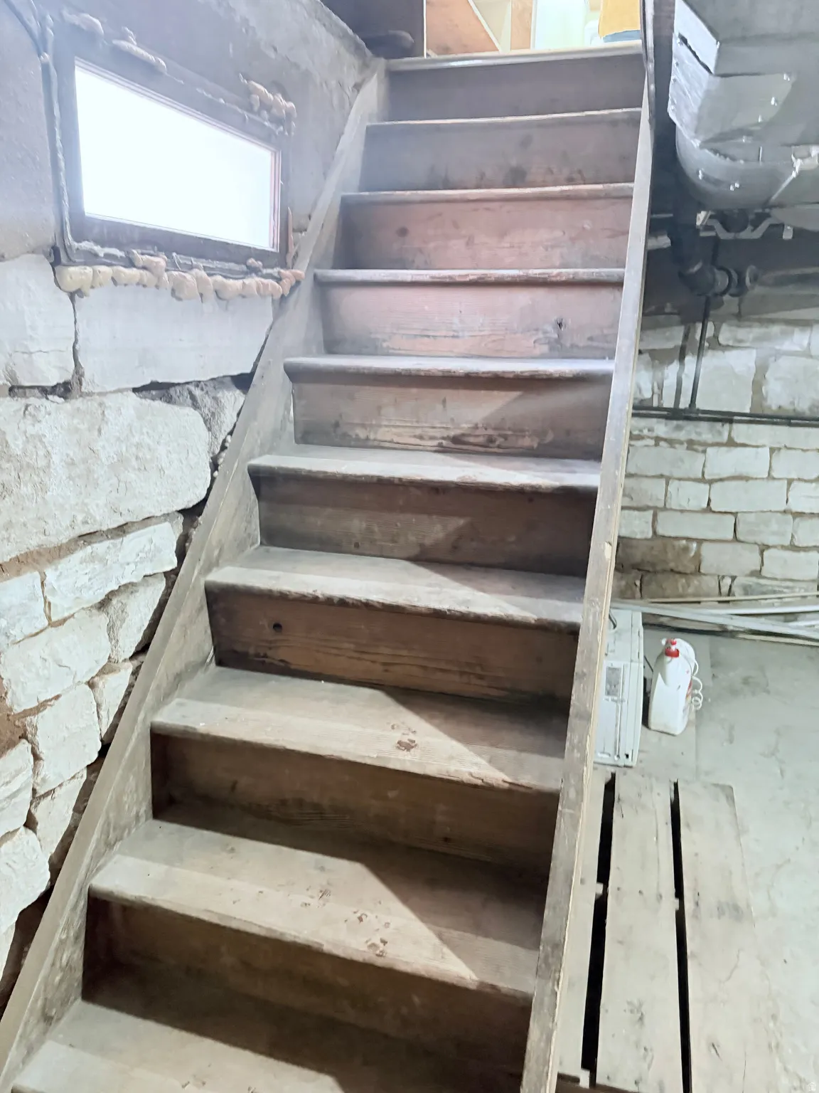 View of stairway leading to partial basement.