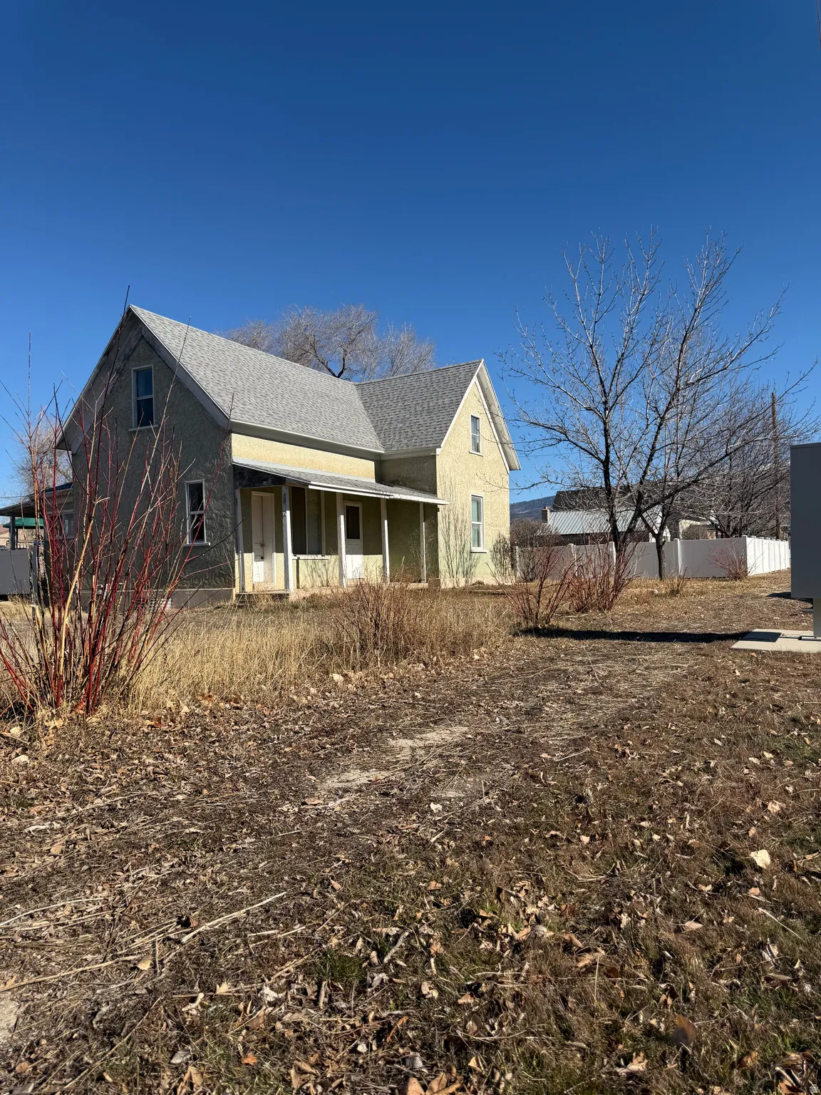 Rear view of house featuring a porch