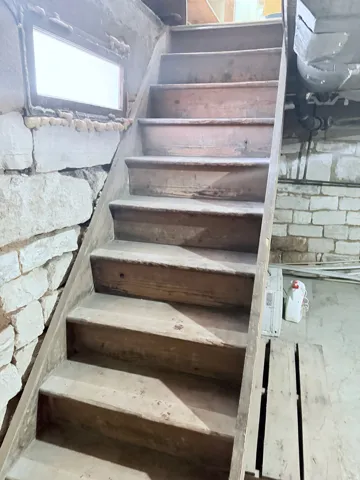 View of stairway leading to partial basement.