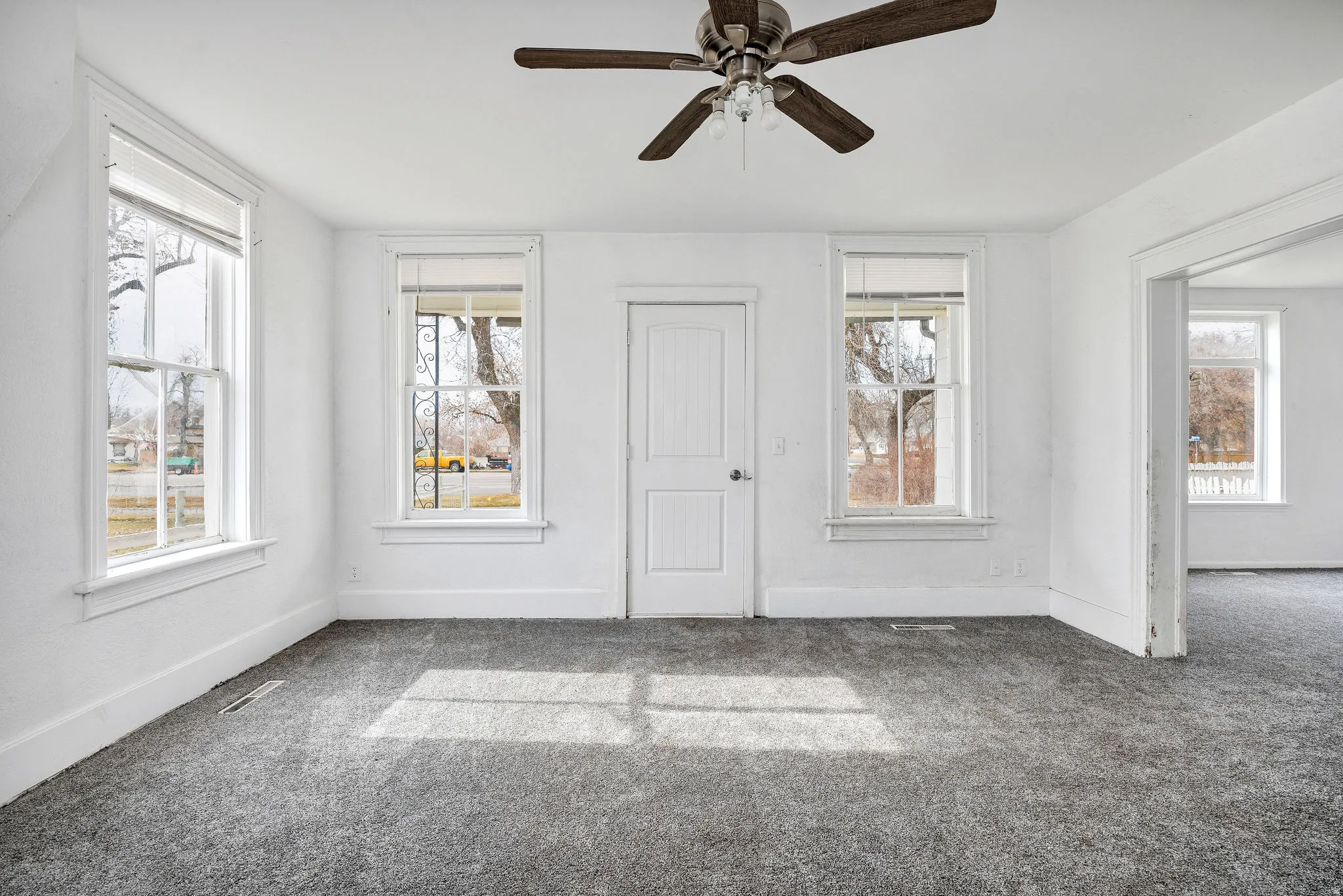 Spare room with carpet floors and ceiling fan