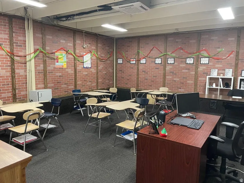 Home office with cooling unit and brick wall