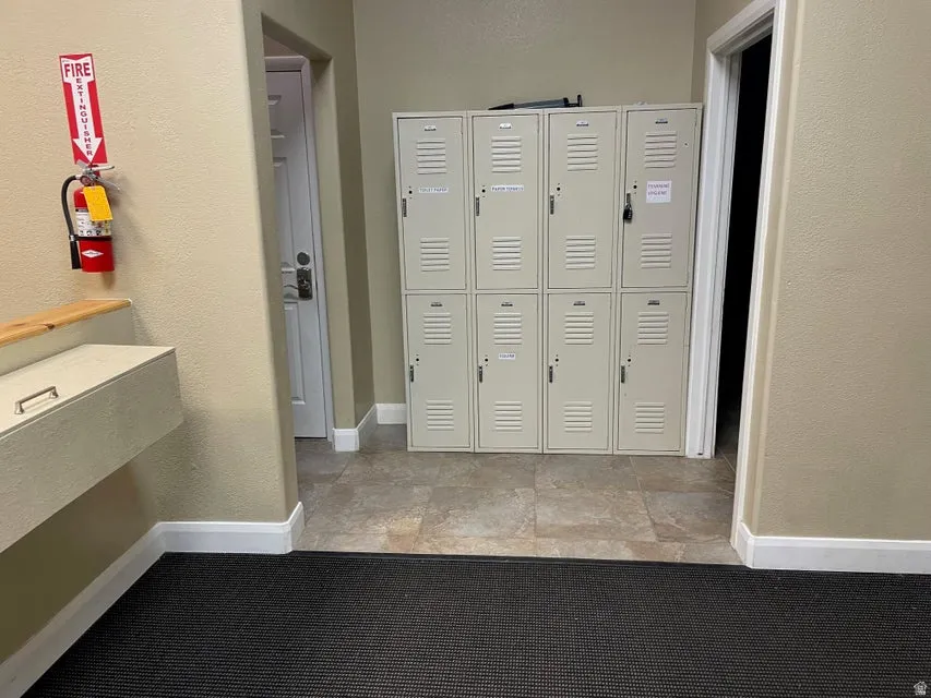 View of community featuring a textured wall