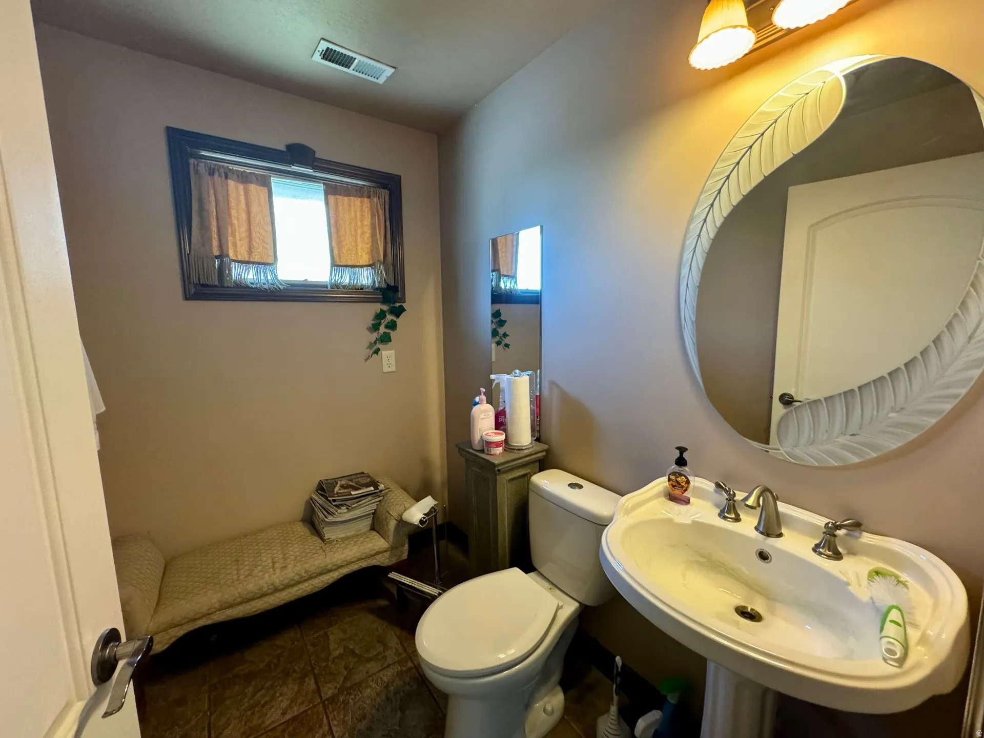 Half bath with toilet and a sink