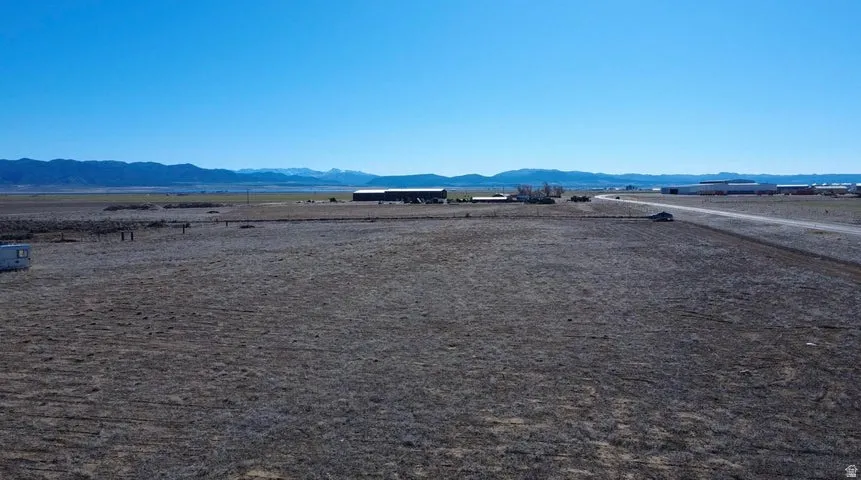 View of yard with a mountain view and a rural view