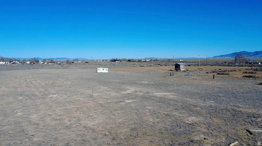 View of yard with a mountain view and a rural view