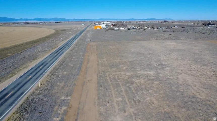 Aerial view of sparsely populated area featuring a mountain backdrop