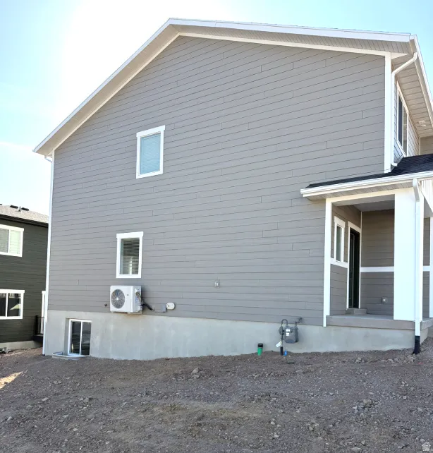 View of property exterior with a cooling unit