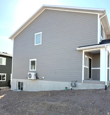 View of property exterior with a cooling unit