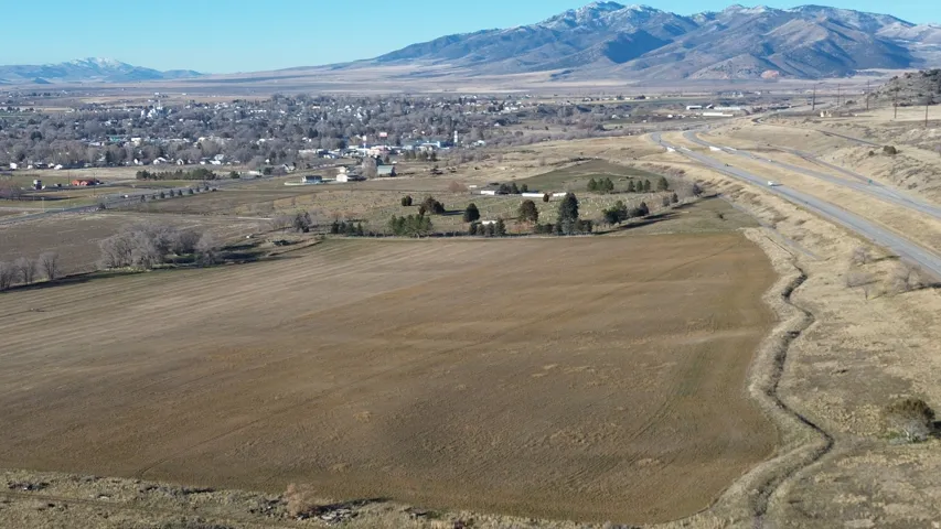 View of property location featuring a mountain backdrop and rural landscape