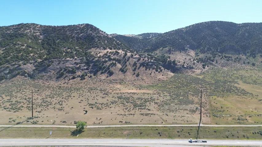 Expansive mountain backdrop featuring varied terrain and natural vegetation