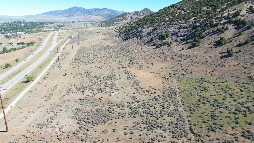 Expansive undeveloped acreage featuring varied terrain with a natural landscape