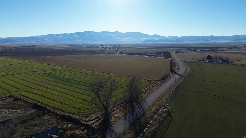 View of rural area with a mountainous background and abundant farmland