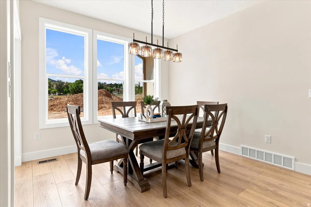 Recessed lighting, wood-finish flooring, and multiple windows