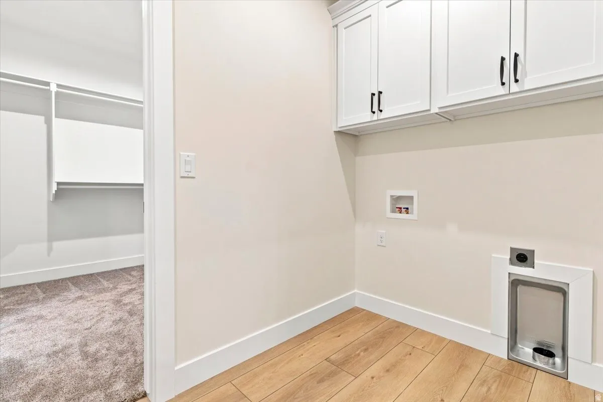 White shaker cabinetry with black hardware