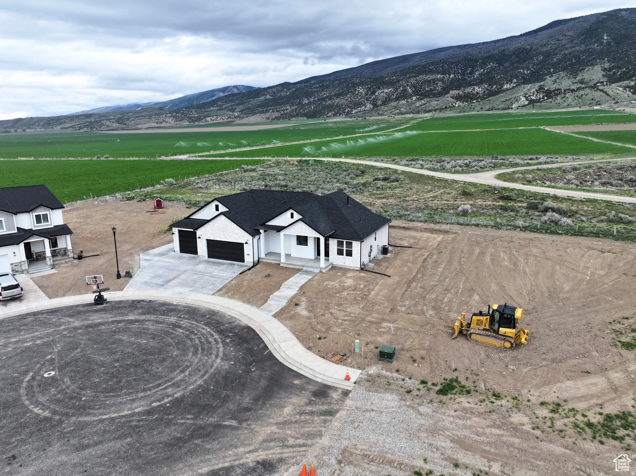 Aerial view of sparsely populated area featuring a mountain backdrop