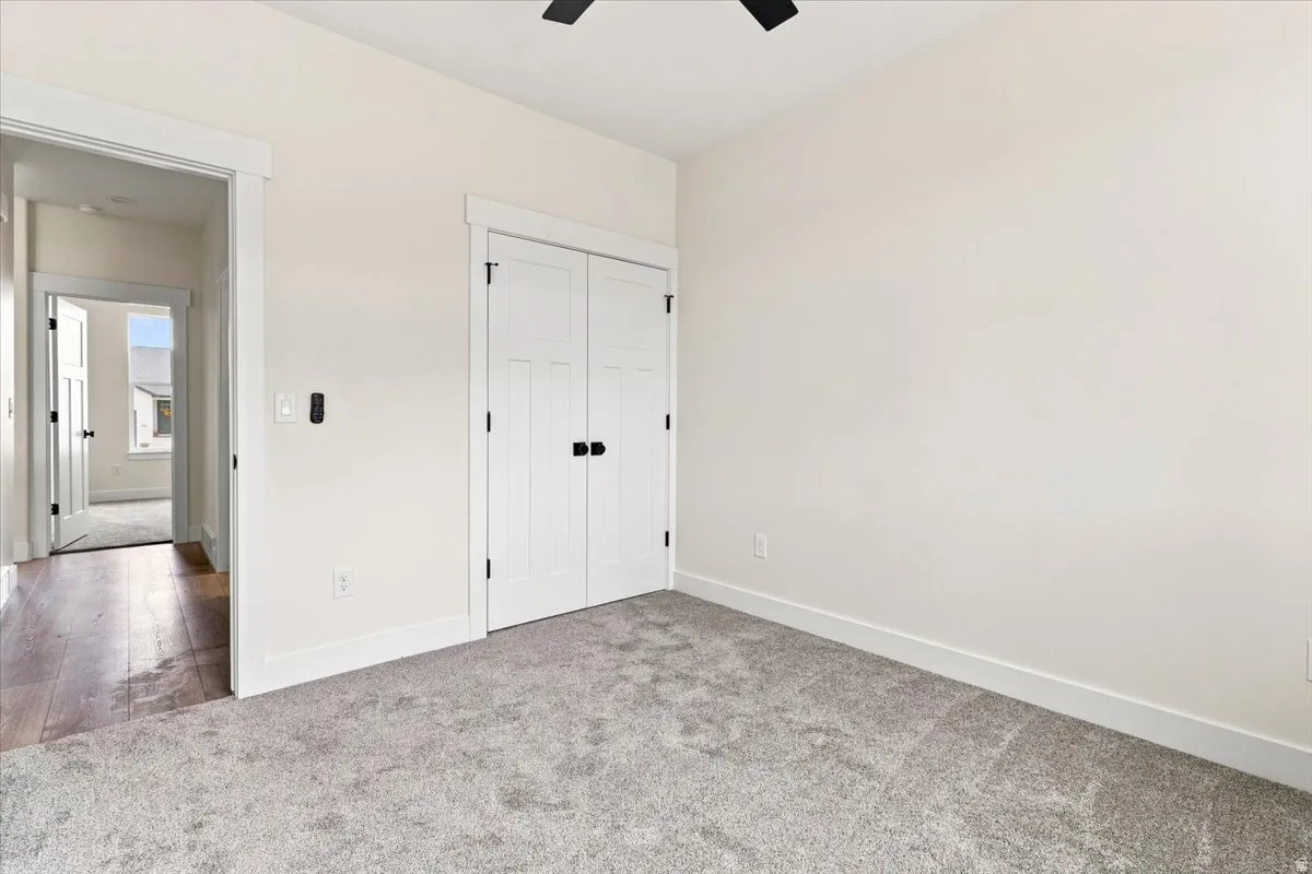 Soft gray carpeting complementing light-toned walls