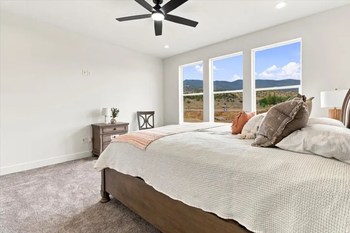 Carpeted flooring, recessed lighting, and a ceiling fan