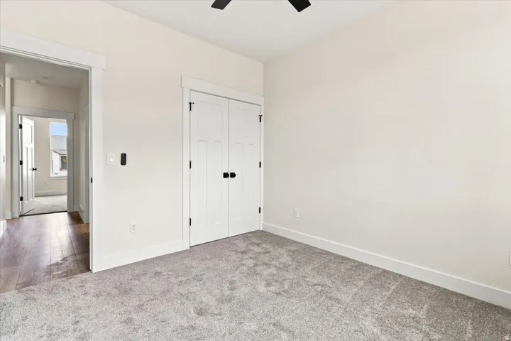 Soft gray carpeting complementing light-toned walls