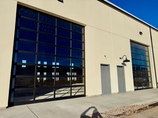 View of building exterior featuring a garage