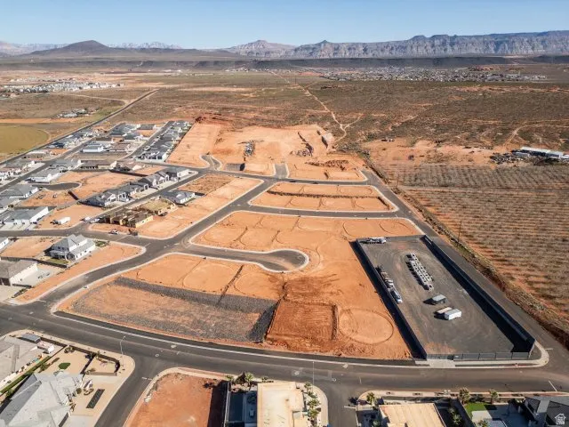 Aerial view of property's location with a mountain backdrop and rural landscape
