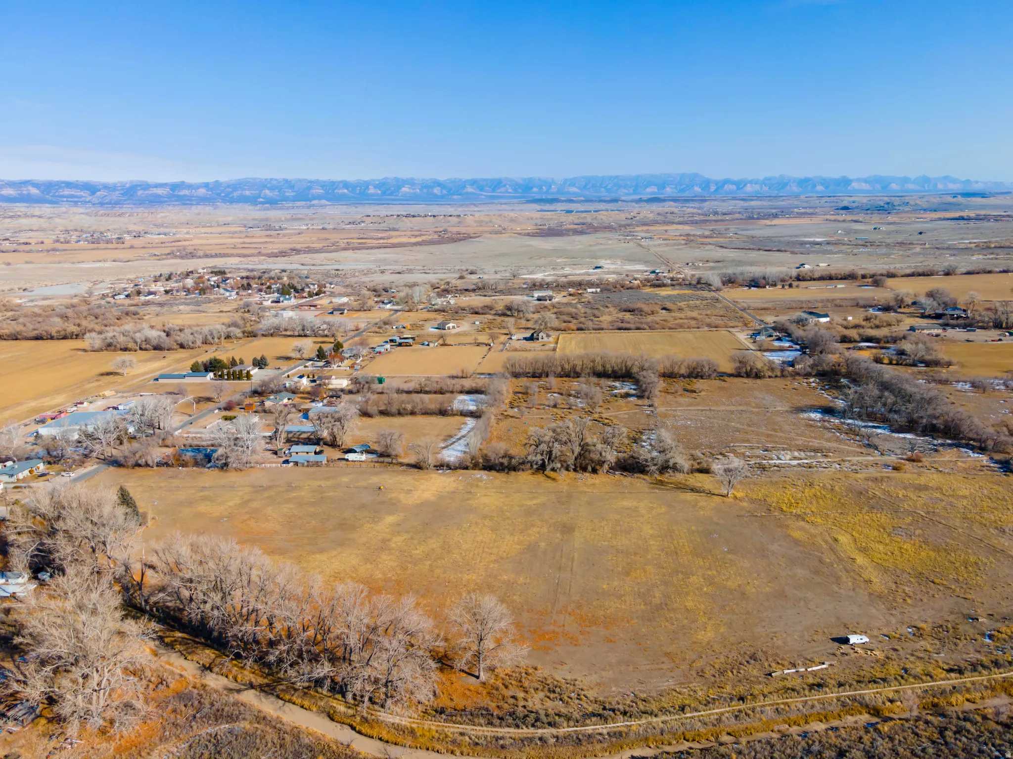Aerial view of sparsely populated area with mountains