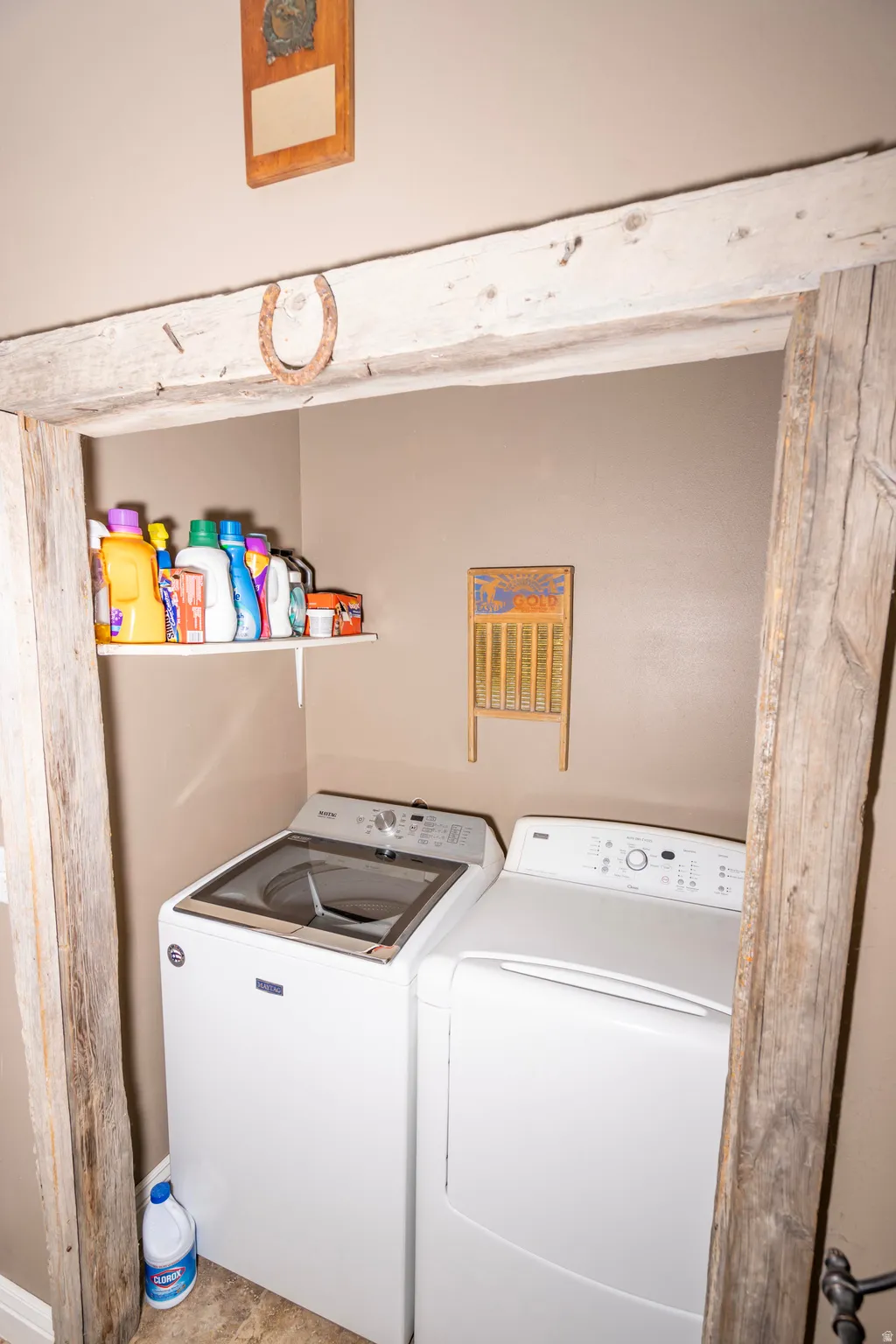 Washroom featuring washing machine and clothes dryer