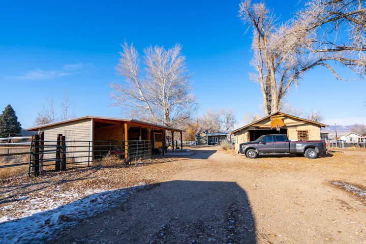 View of side of property featuring an exterior structure and an outdoor structure