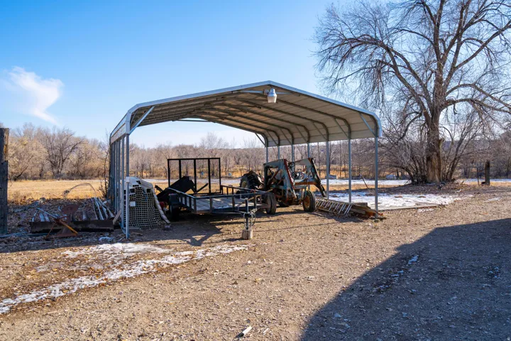 View of outdoor structure featuring a carport