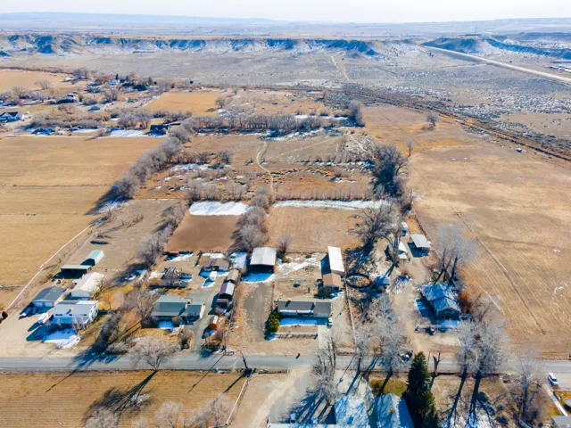 Aerial view of property and surrounding area with rural landscape