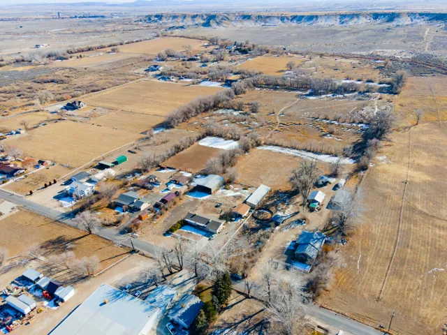Aerial view of property and surrounding area with rural landscape