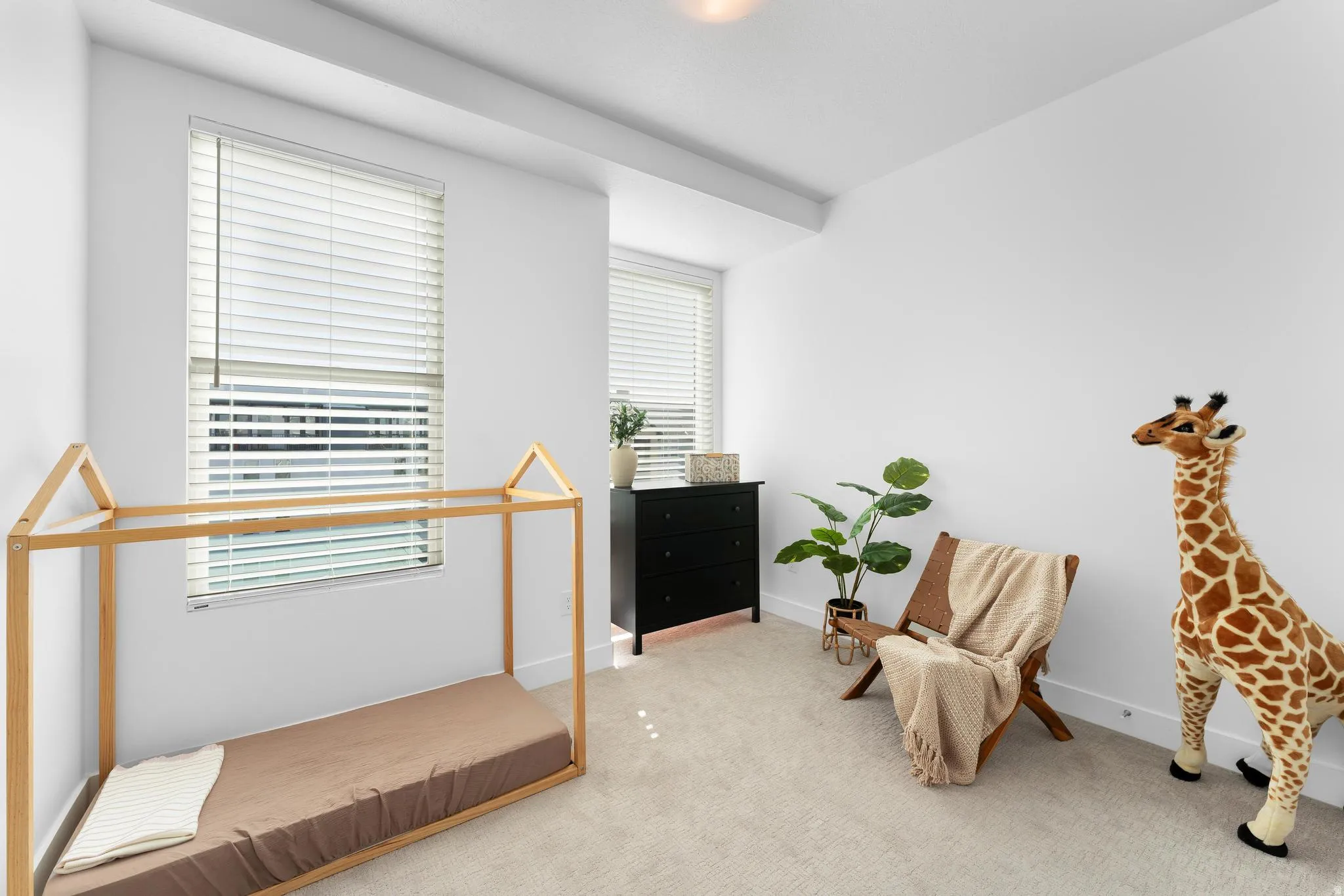 Carpeted bedroom with baseboards