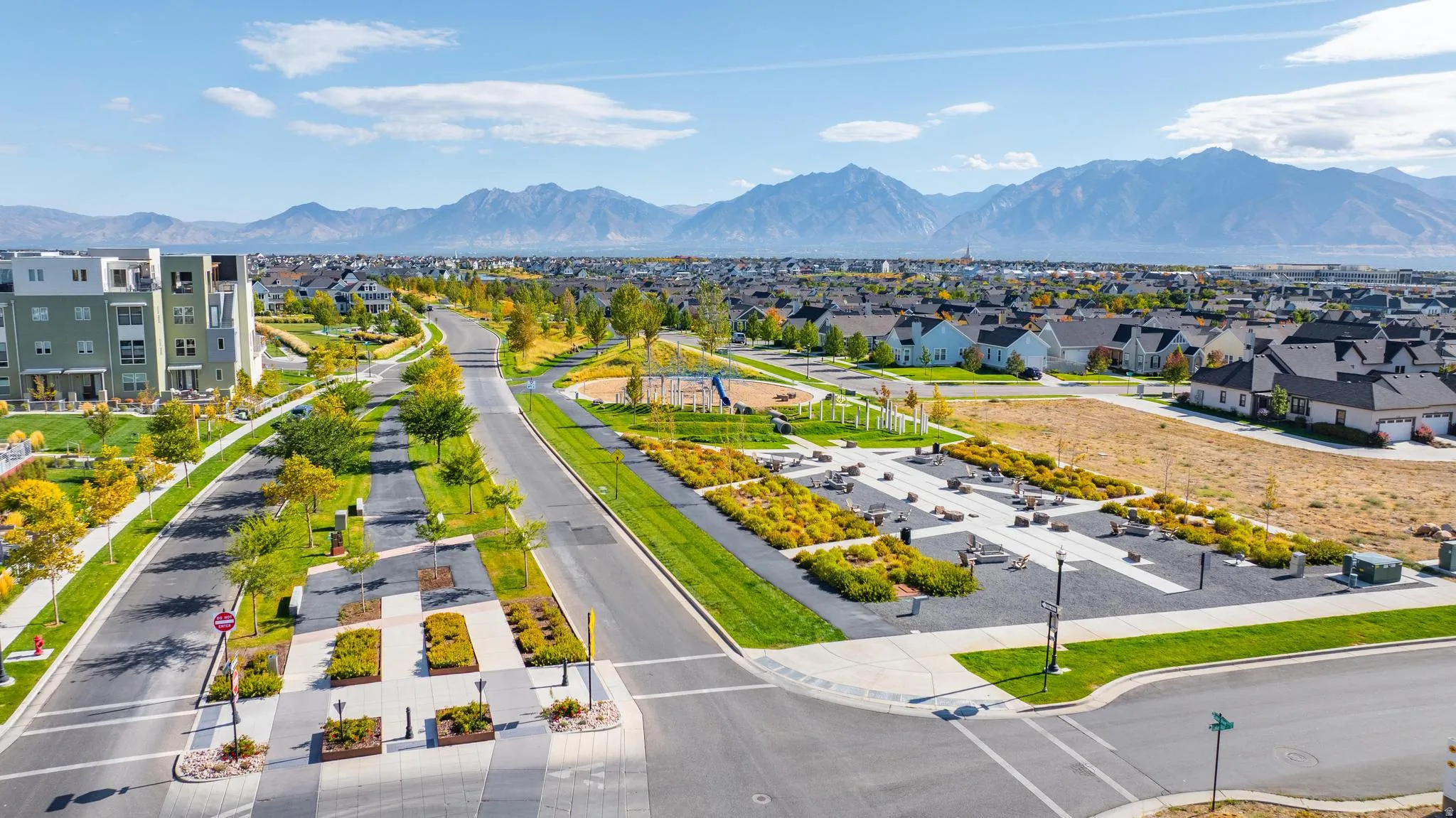 Aerial perspective of suburban area with a mountainous background