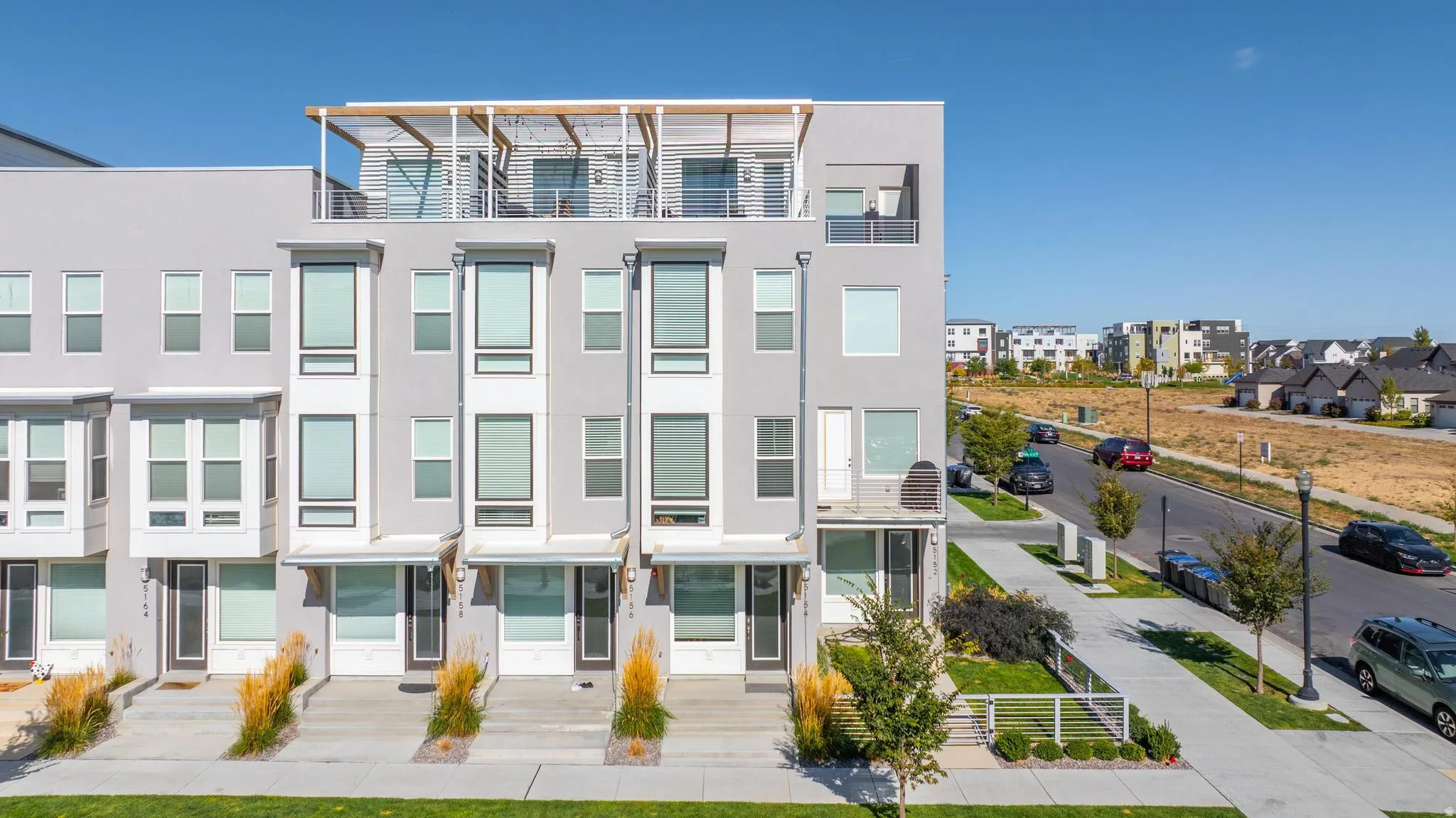 Contemporary house featuring stucco siding and a residential view
